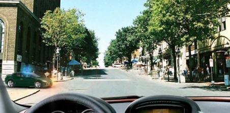 Are you obligated to give way to a passenger car if you continue driving straight ahead?