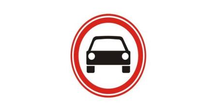 What vehicles are prohibited by this road sign?