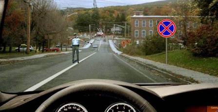 Is the driver obliged to stop at the place indicated by the traffic controller in this situation?