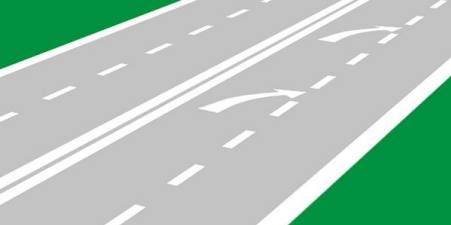 What does arrow markings on the roadway warn you about?