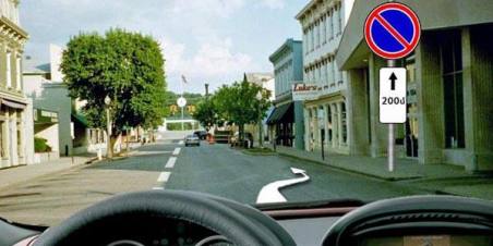 Is it permitted to stop for the purpose of boarding passengers in the area of the specified road signs?